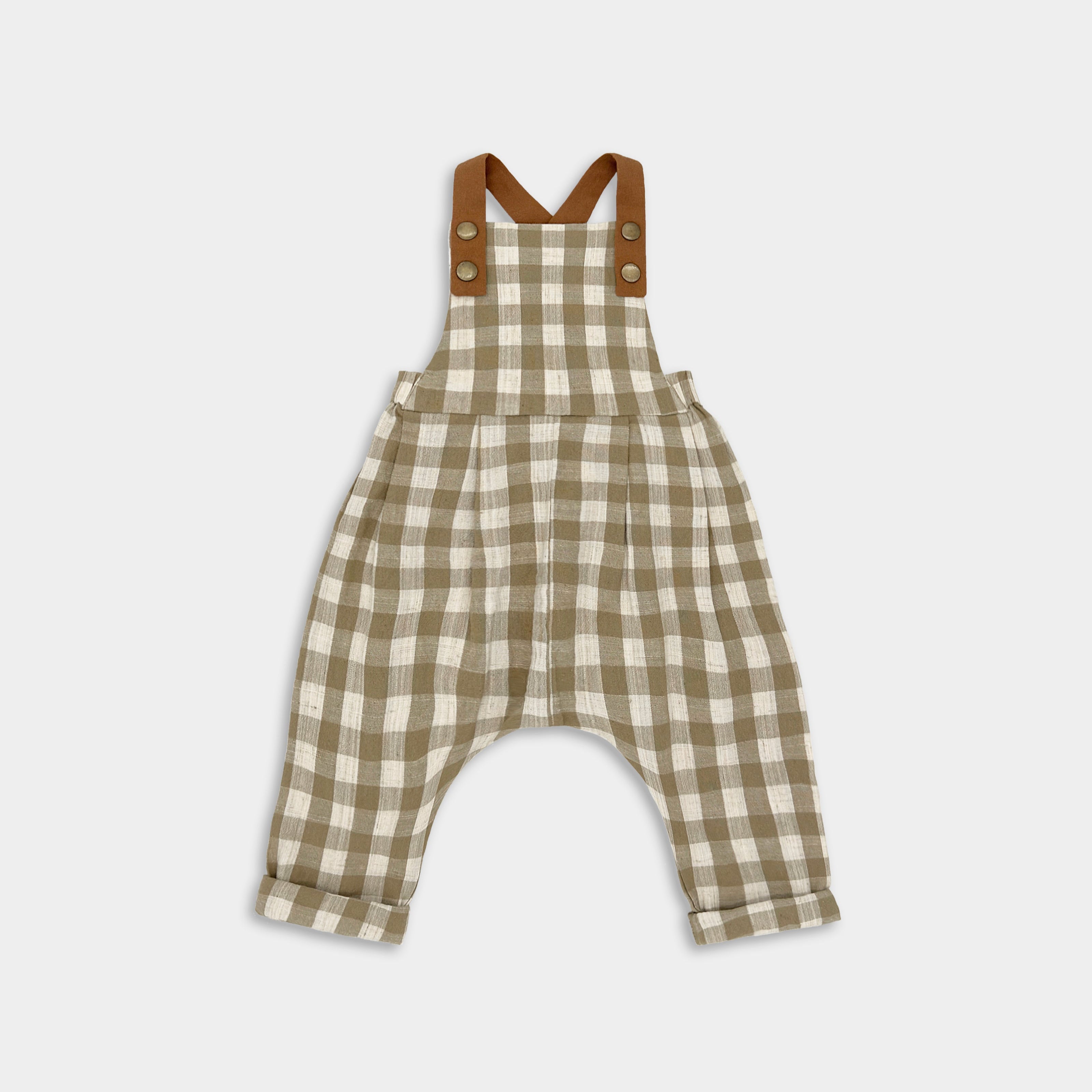 Front view of Beige Gingham linen long overalls for children, featuring gender-neutral design, breathable fabric for all-day comfort, stylish pleats for elegance, durable leather-looking straps, adjustable straps for a perfect fit, and unfoldable leg cuffs that allow for growth.