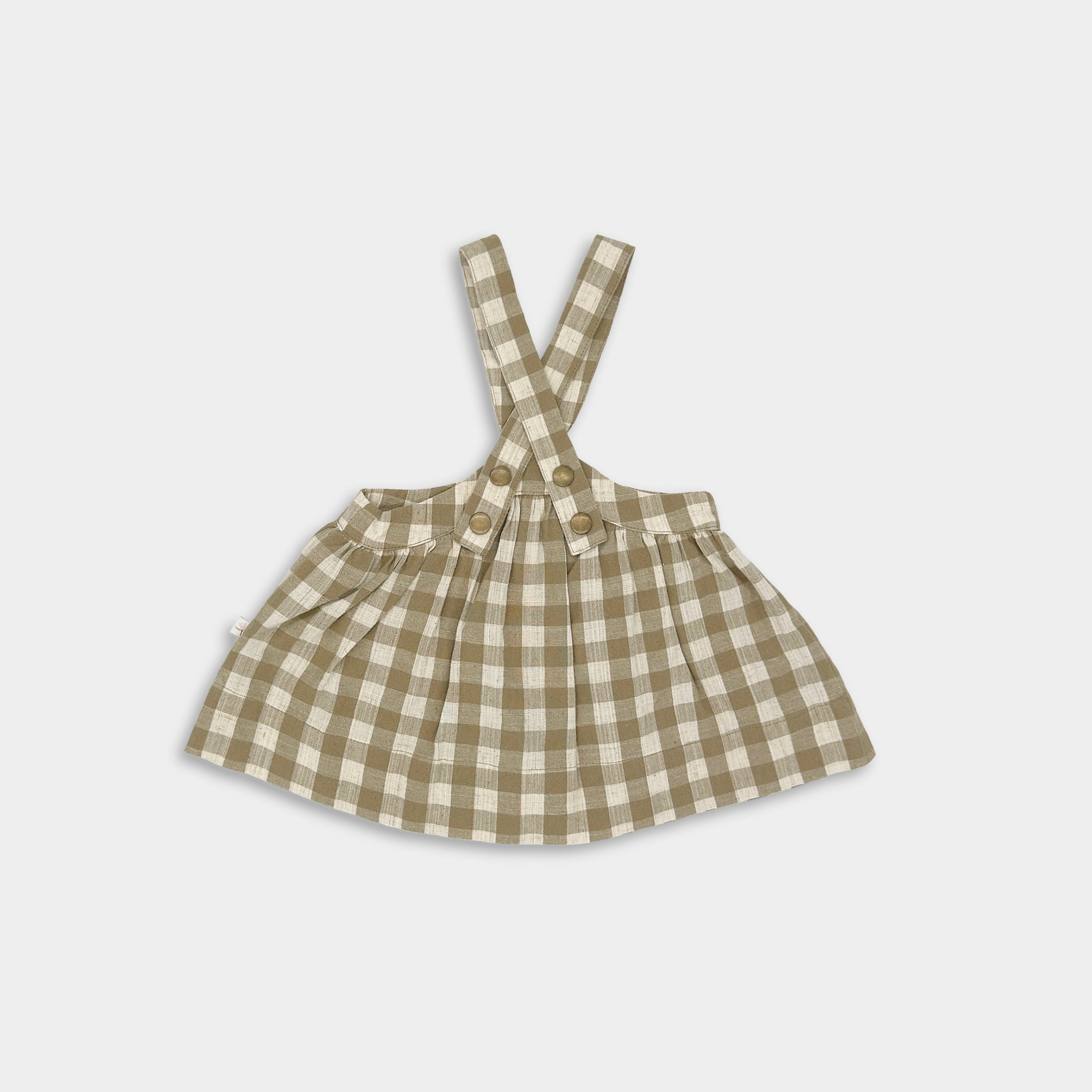 Back view of a Beige Gingham Pinafore made from high-quality linen, featuring a unique design with adjustable high-waist straps for a cute vintage-inspired fit, built to last with an extra 2" of hem allowance for growth, V-shaped straps to keep them securely on the shoulders, and adjustable straps available in three lengths for layering and continued growth.