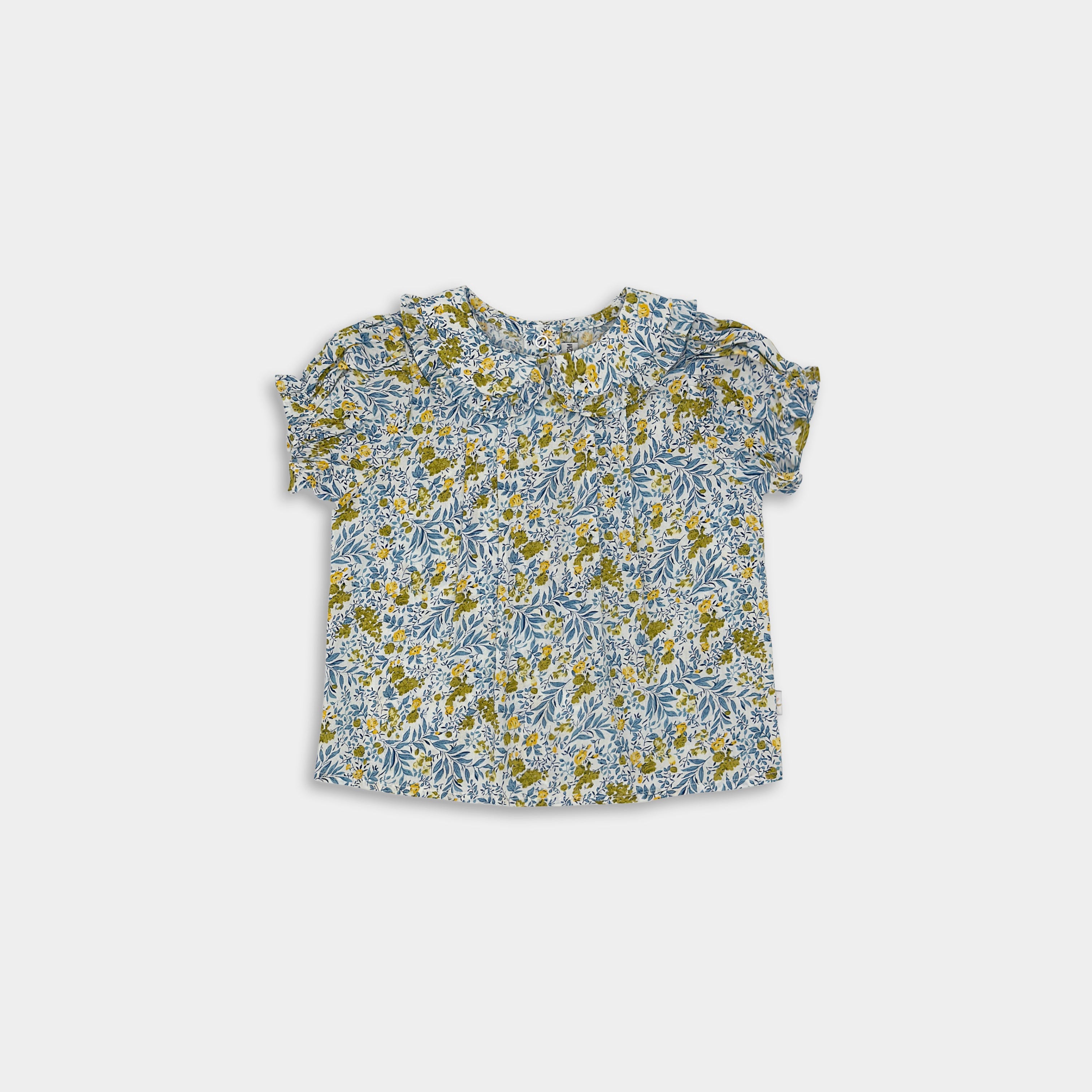 Elegant floral blouse in Blue Floral, featuring a traditional floral pattern and stylish pin tucks, perfect for elevating a child’s wardrobe.