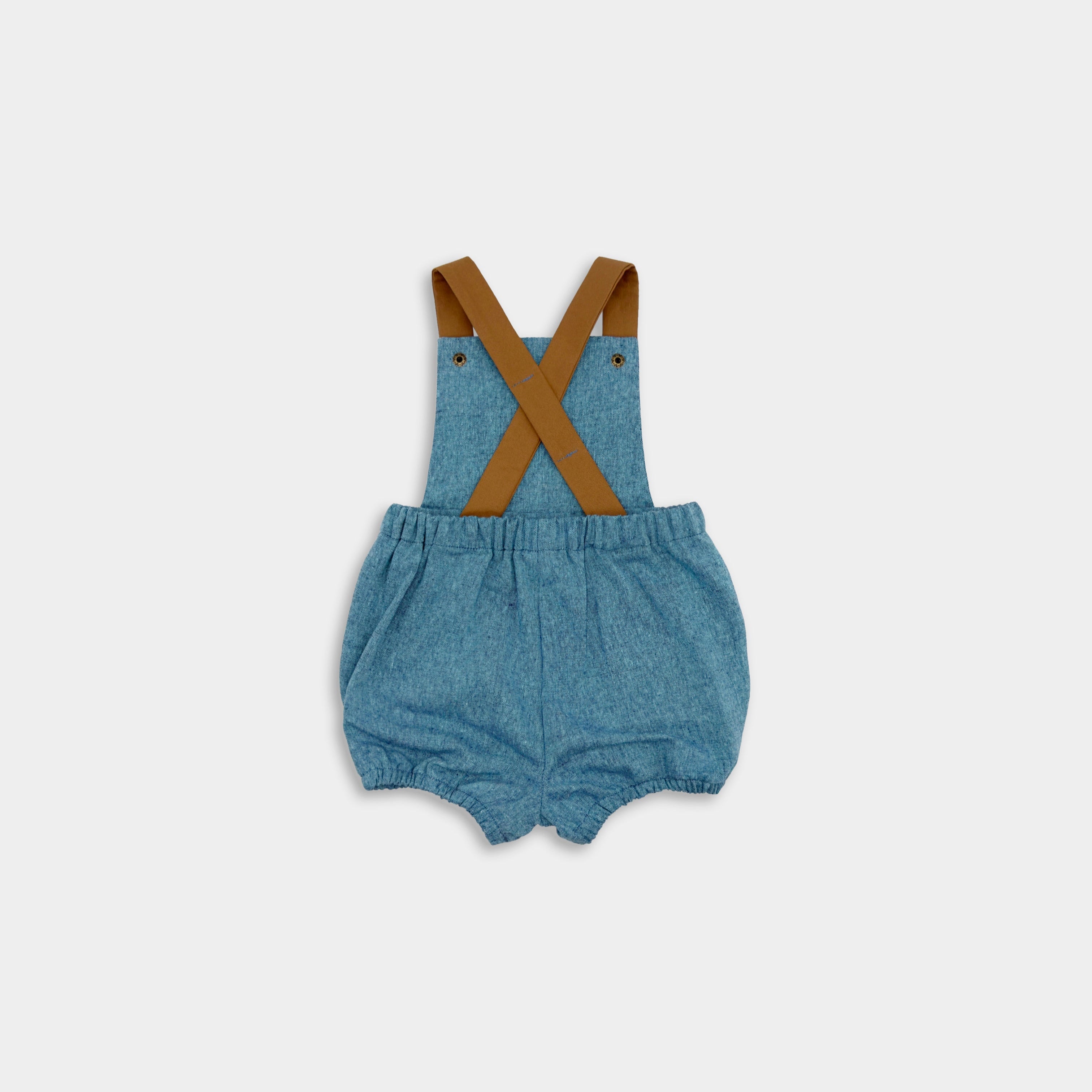 Back view of the Blue Jay bubble romper. This gender-neutral romper is ideal for playtime and includes brown adjustable straps for a customizable fit, elasticized legs for easy movement during summer activities, and a timeless style that is perfect for any occasion, boys and girls.