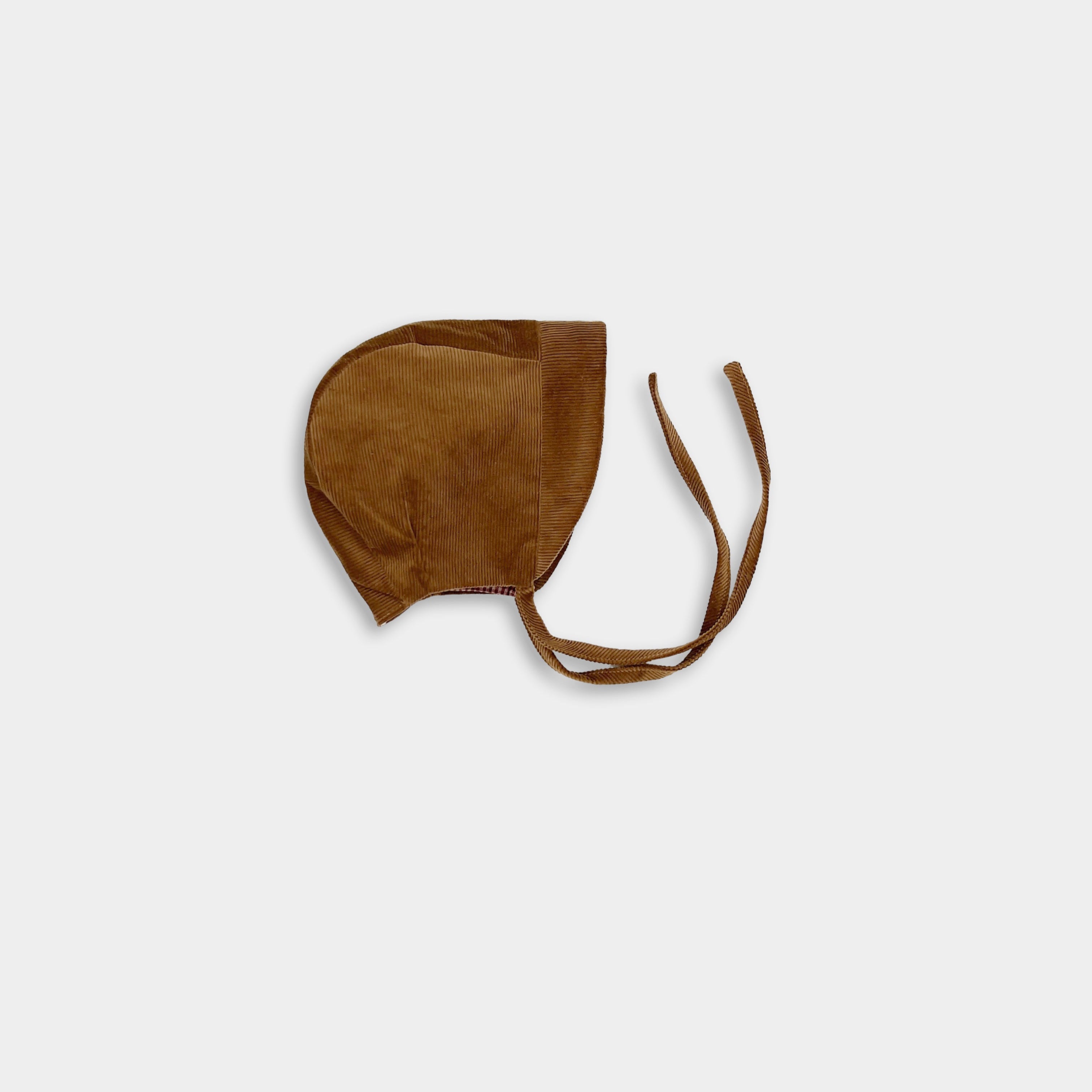 Photo of the Camel Bonnet alone - This image showcases the cozy corduroy bonnet, highlighting its classic design and soft texture, making it an adorable accessory for little ones