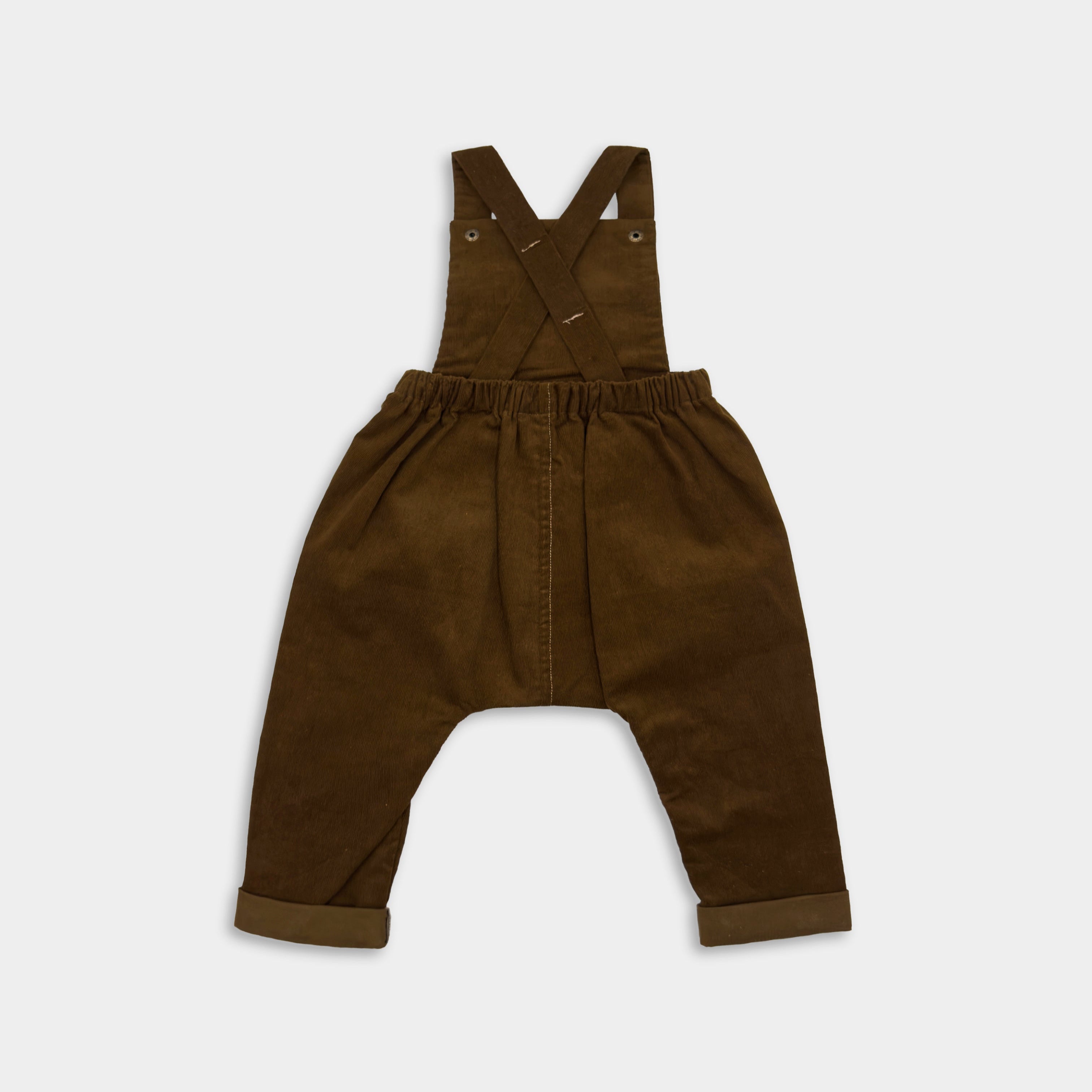 Back view of handmade cocoa brown long overalls displayed on their own, emphasizing the quality materials and stylish design for little adventurers.