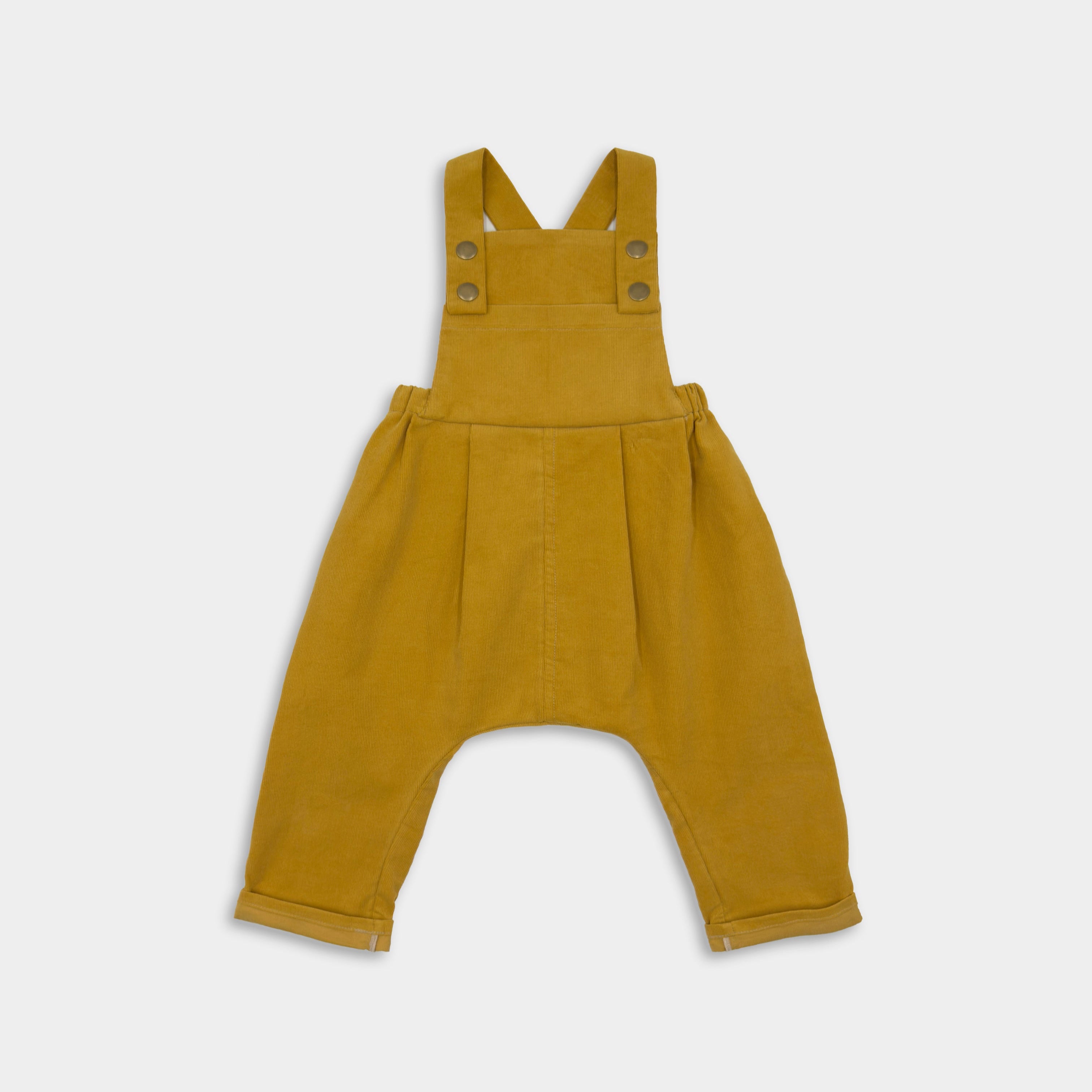 Front view of the Ginger Corduroy Long Overalls showcasing the warm color and detailed stitching, pleats, generous bib and rolled leg cuffs for growth.