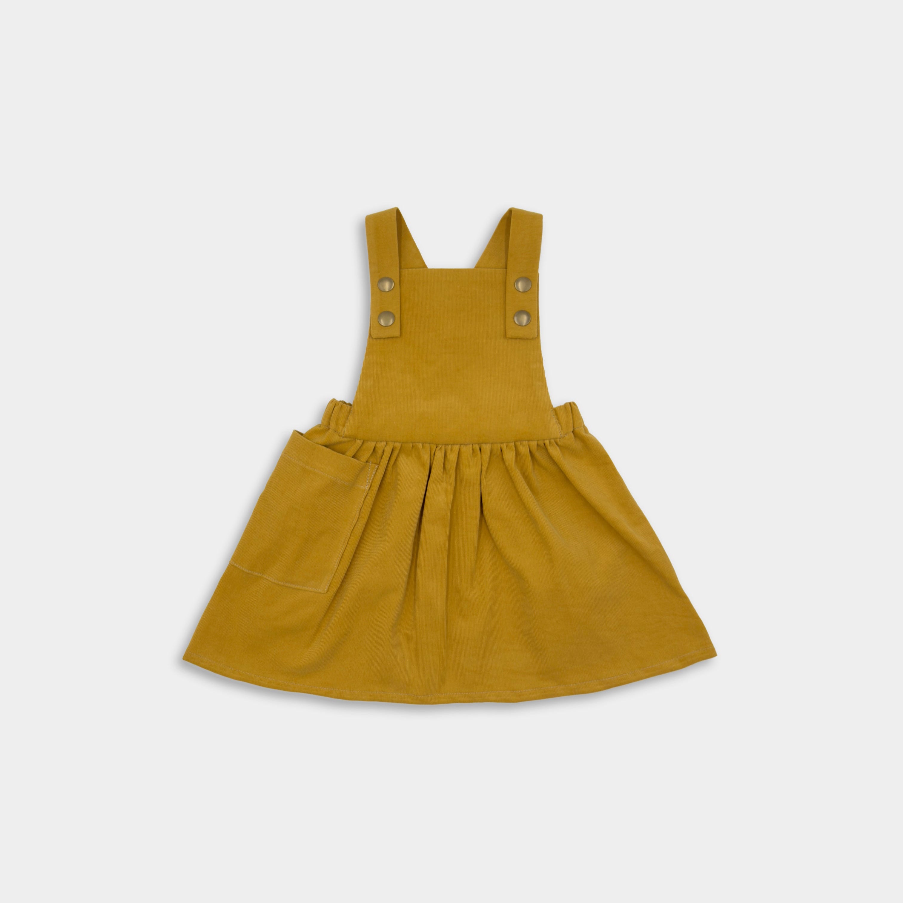 Front view of the Mustard Pinafore, a classic and timeless design made from repurposed 100% soft corduroy, showcasing its stylish and eco-friendly appeal for little girls.