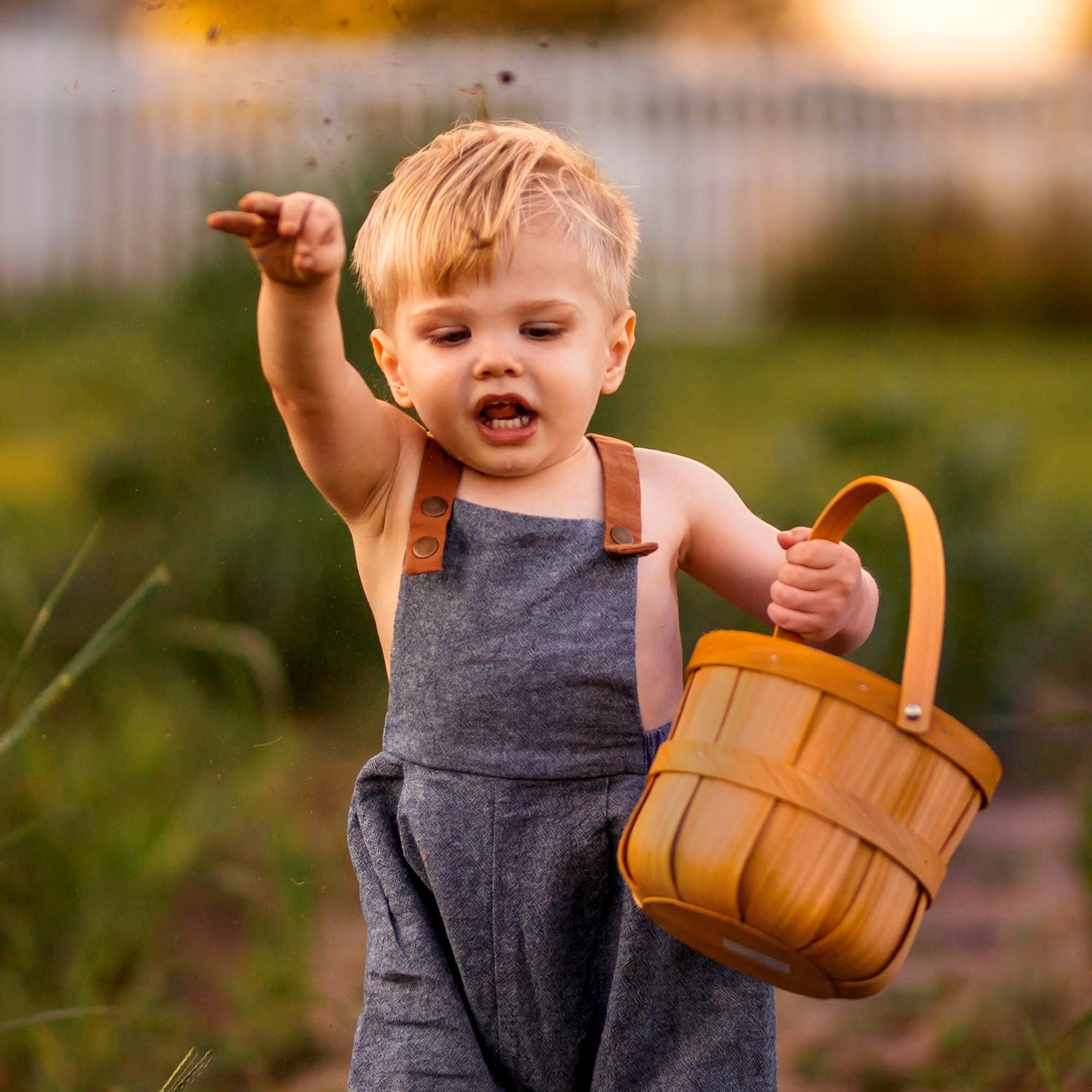 Model Playing with Soil in Chambray Blue Linen Long Overalls: An 18-month-old model is shown wearing the Chambray Blue Long Overalls while playing with soil, showcasing the breathable fabric that ensures comfort during playful activities.