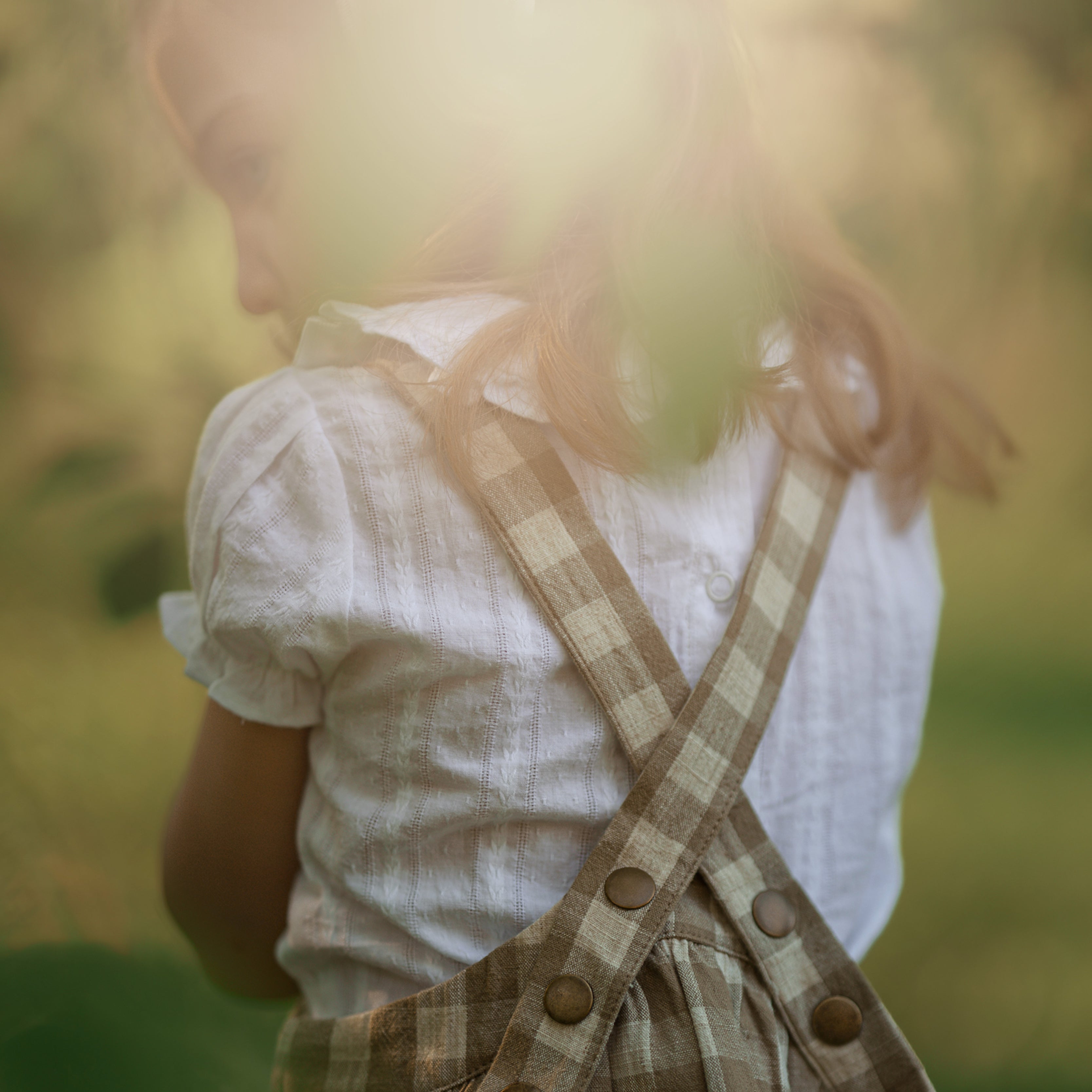 Back view of white blouse backlit