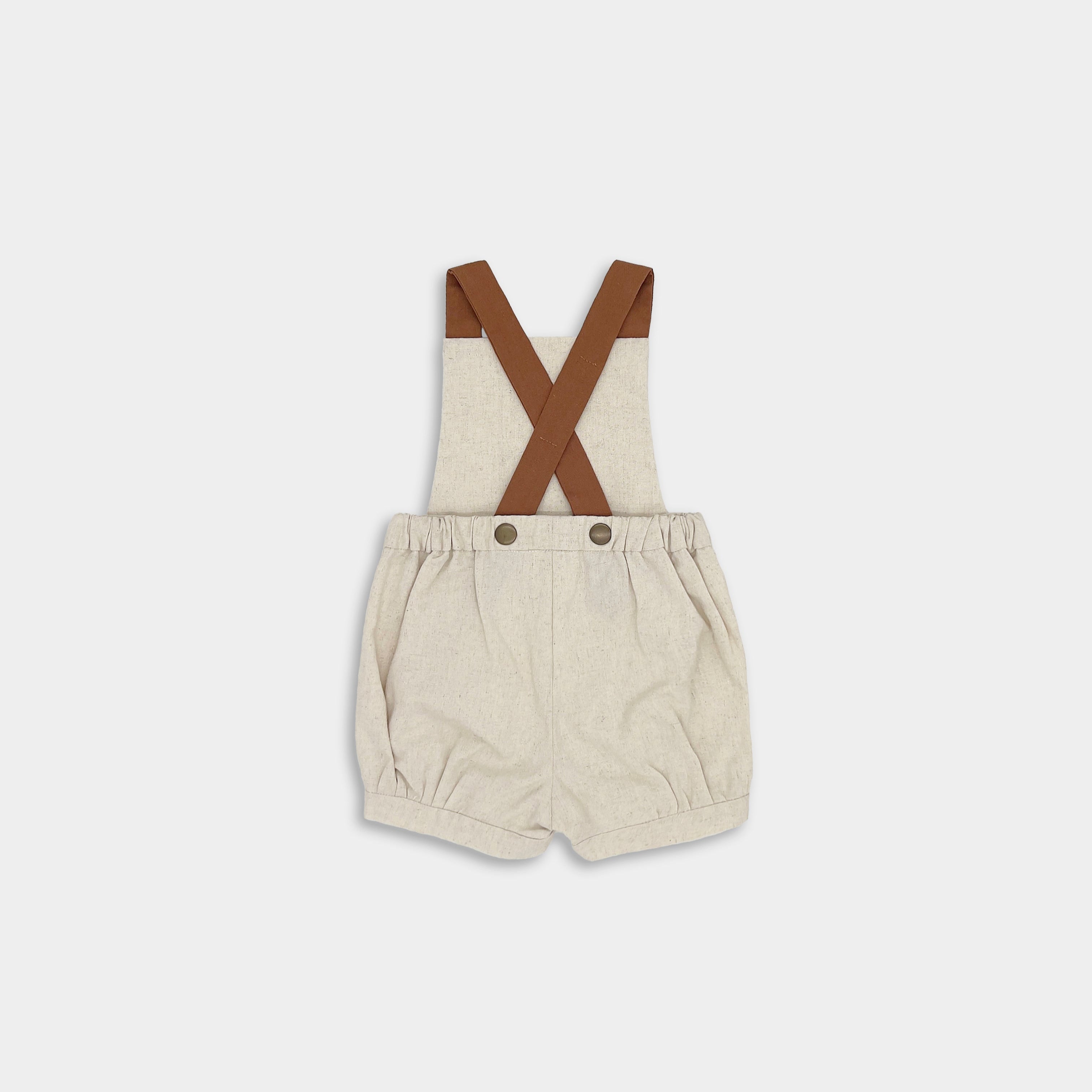 back of natural short overalls on a white background