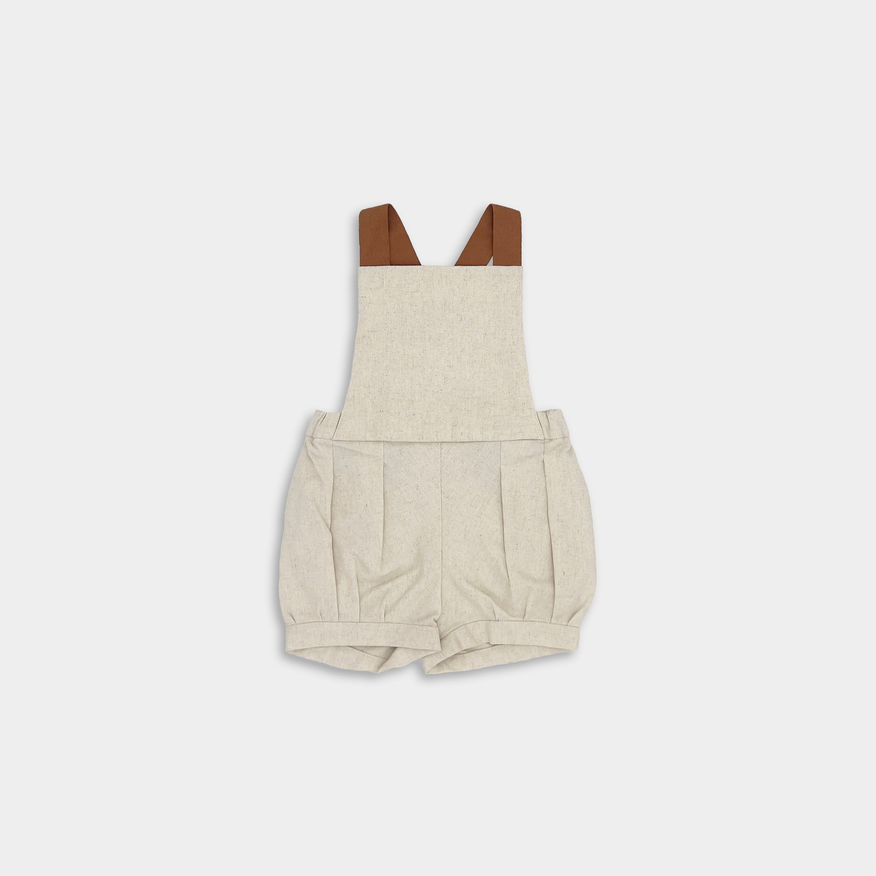 front of natural short overalls on a white background