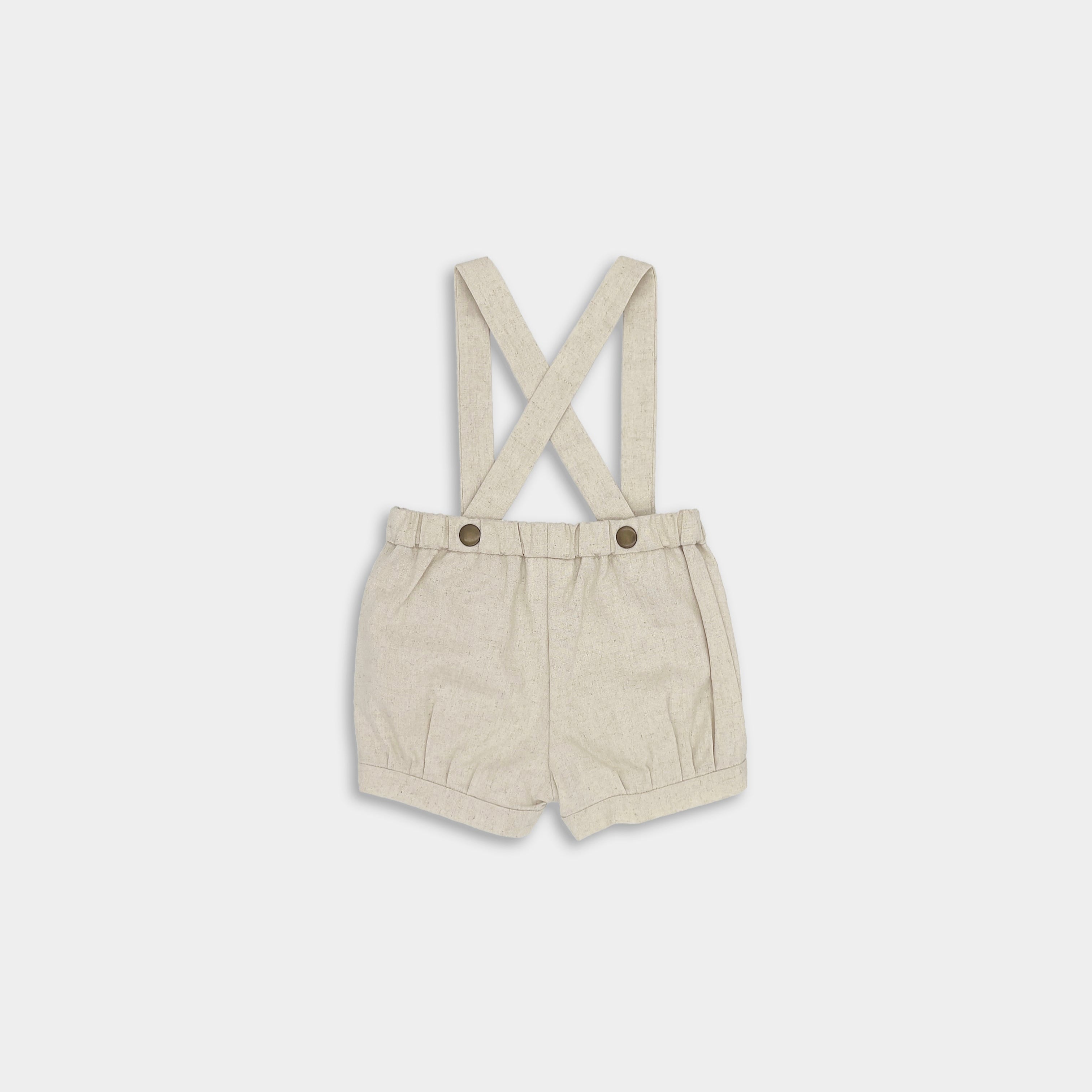back of natural suspender shorts on a white background