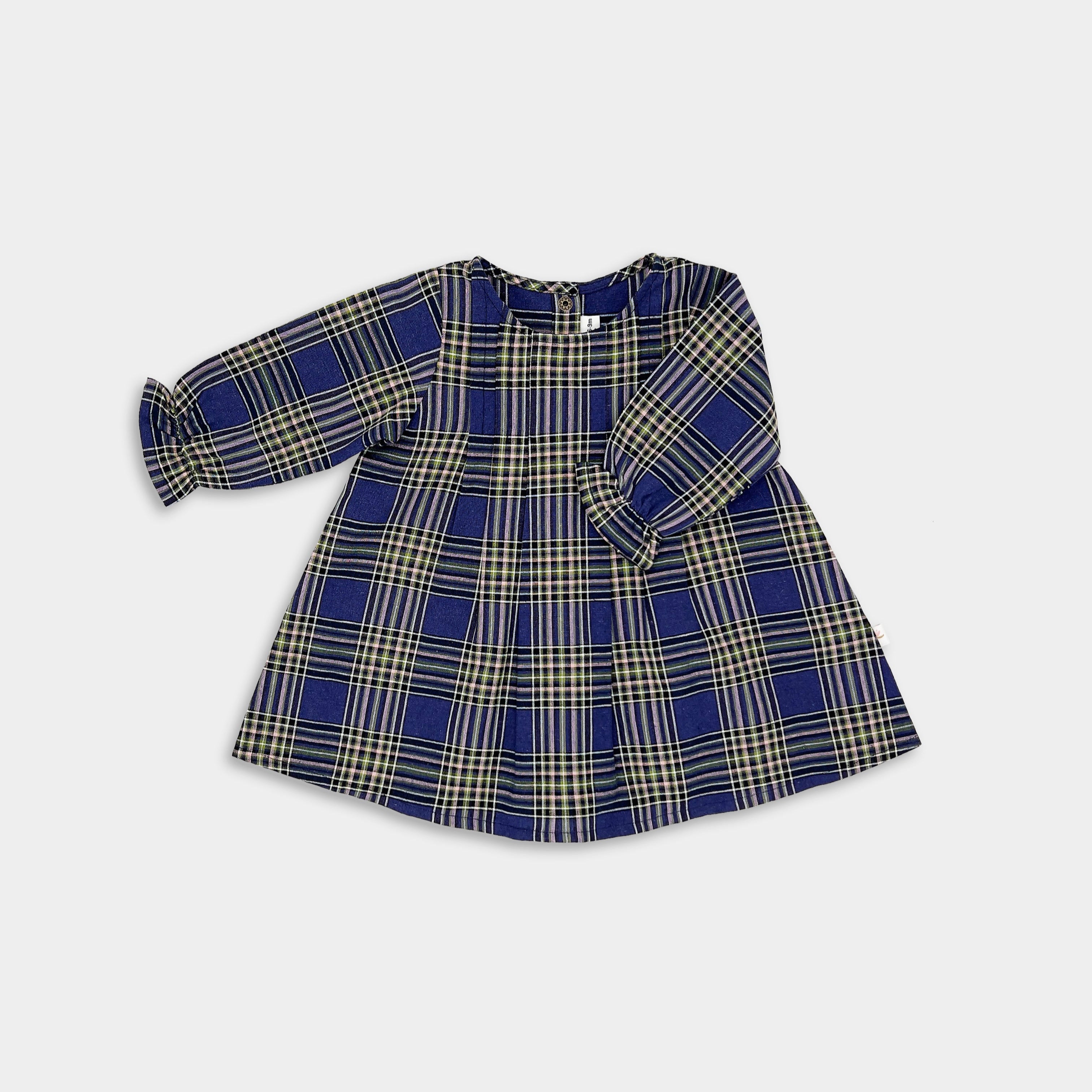 A navy blue plaid long sleeve dress for girls, with pleated back yoke and ruffled hem.