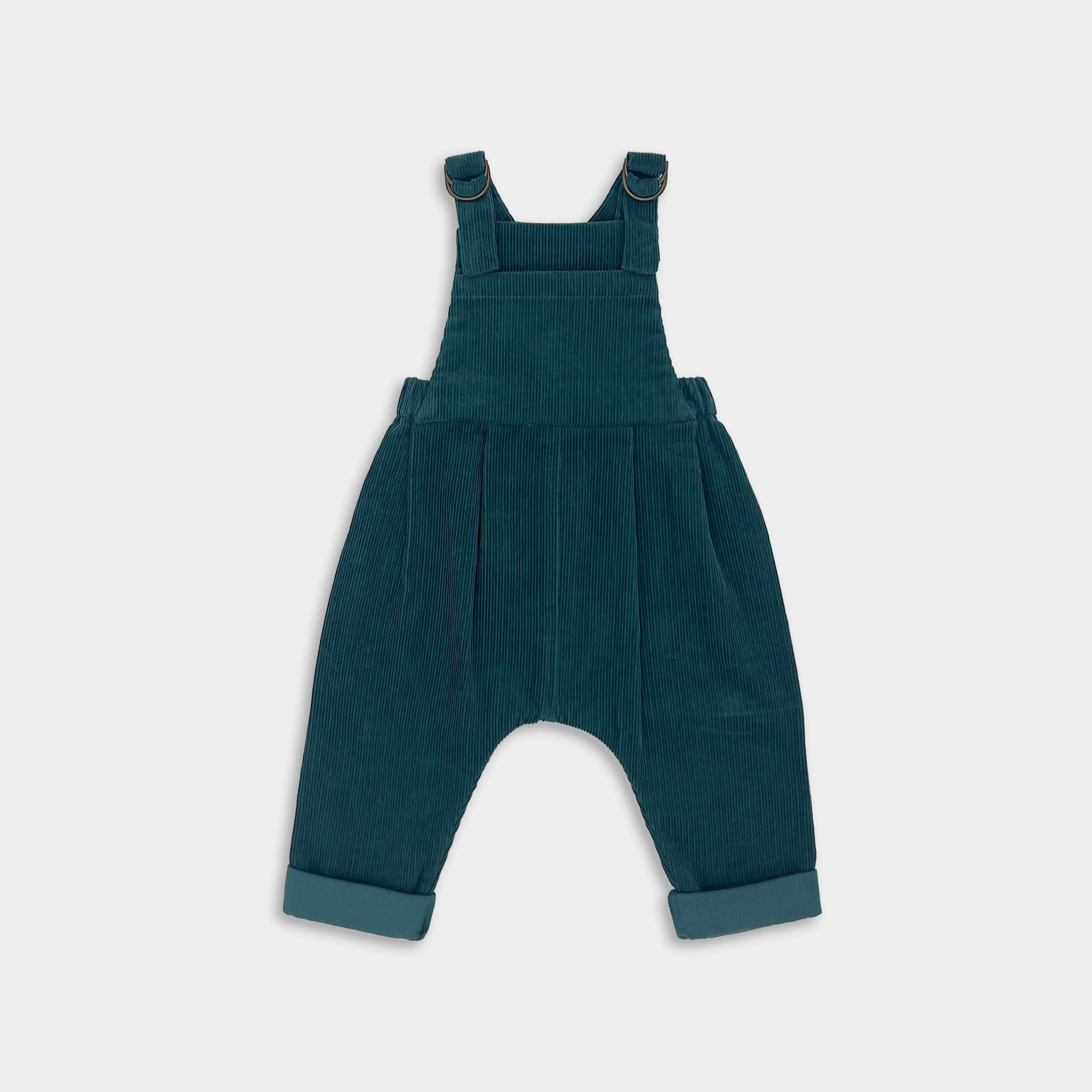 Green overalls on a light gray background