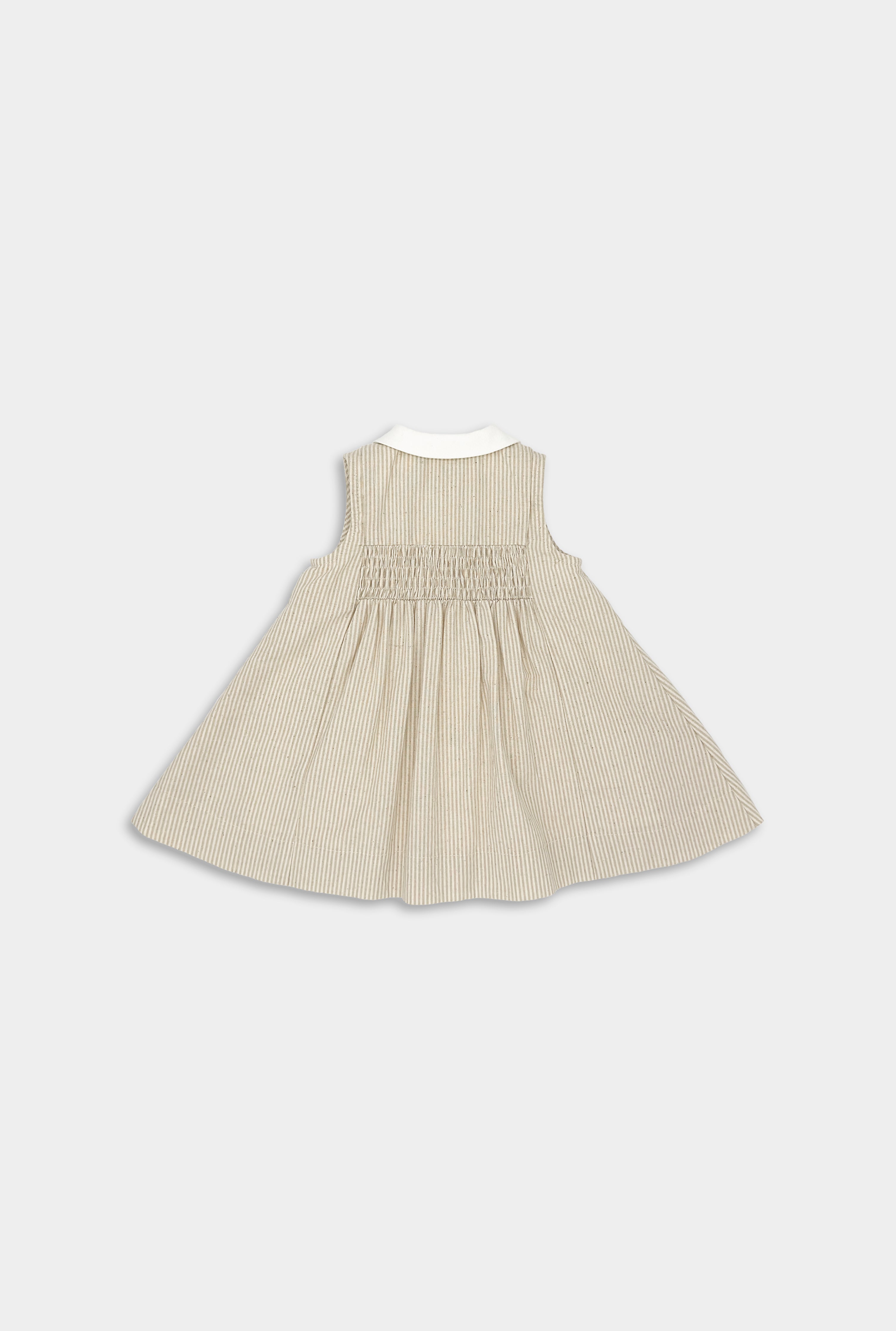 Back view of Beige Stripes Dress designed for little girls, featuring vintage-inspired sleeveless style, white contrasting collar and button placket, adorable smocking and pleat accents, quick Antique Brass lead-free snap closure, playful above-the-knee length, fully lined with 100% cotton for comfort, and pre-washed to maintain shape and minimize shrinking, blending fun and elegance in sustainable children's wear.