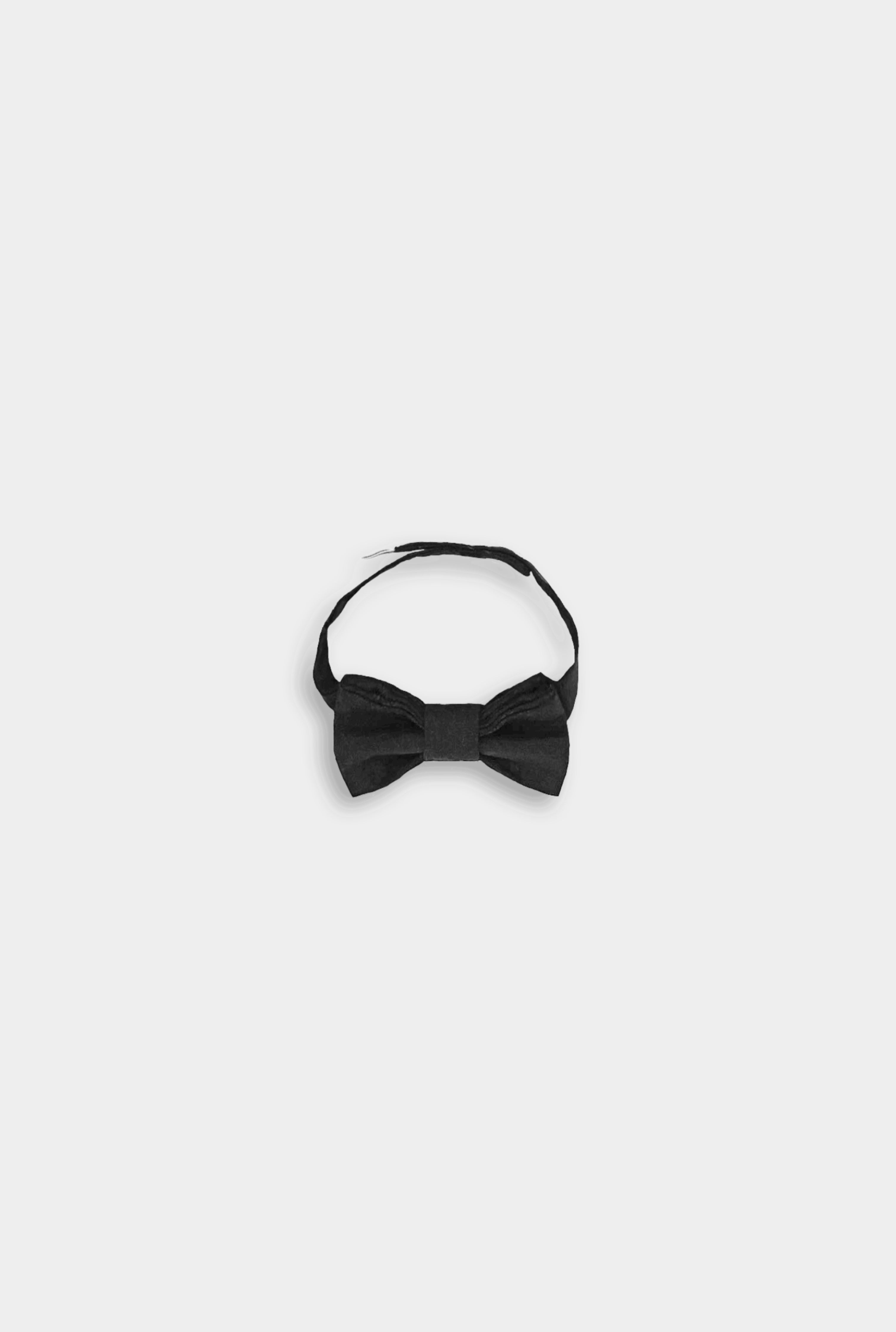 Details of A black linen classic bow tie, featuring a timeless design, versatile for various outfits, available in two sizes for wearing over a shirt or on its own, and perfectly complementing bestselling suspender shorts and overalls.
