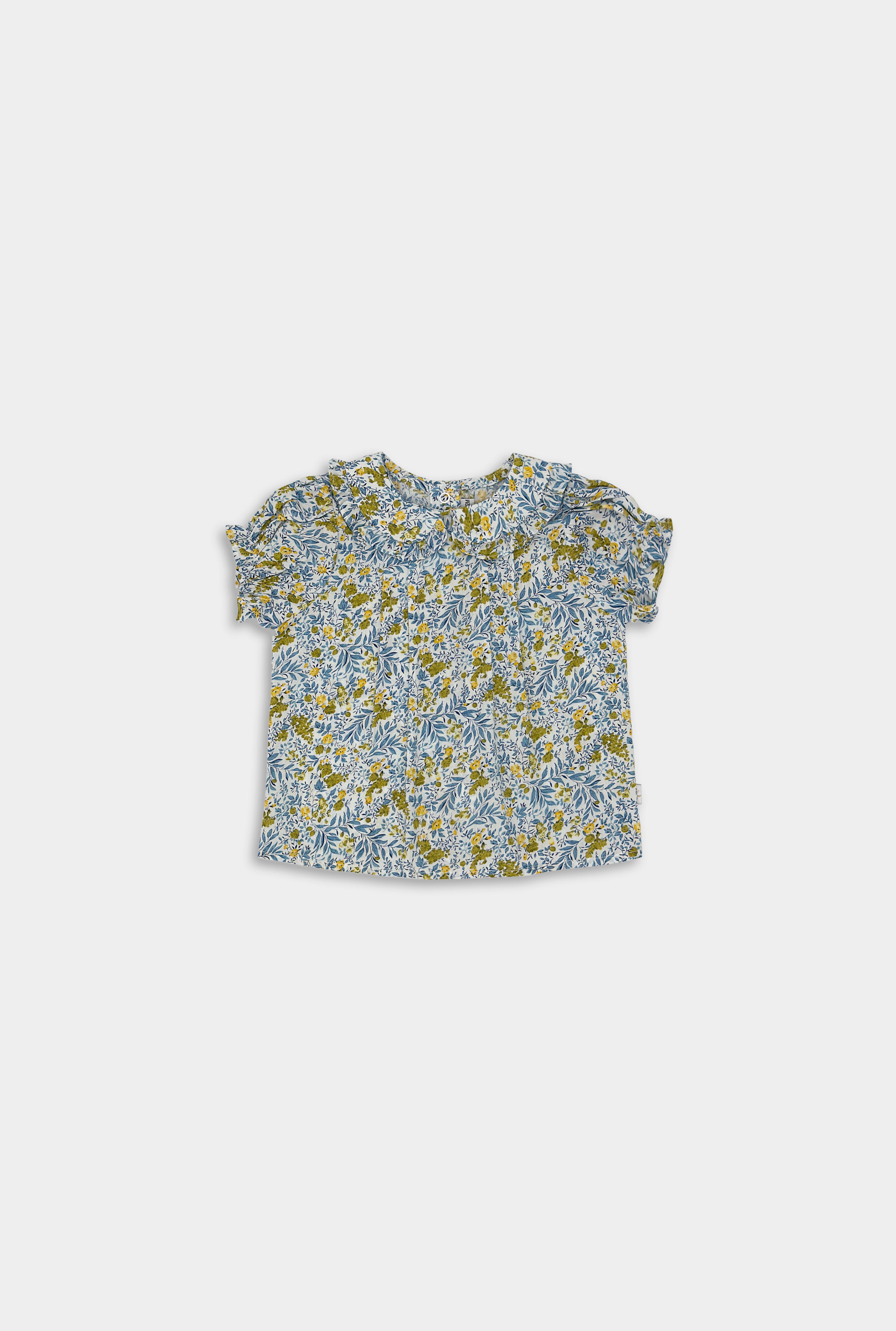 Elegant floral blouse in Blue Floral, featuring a traditional floral pattern and stylish pin tucks, perfect for elevating a child’s wardrobe.