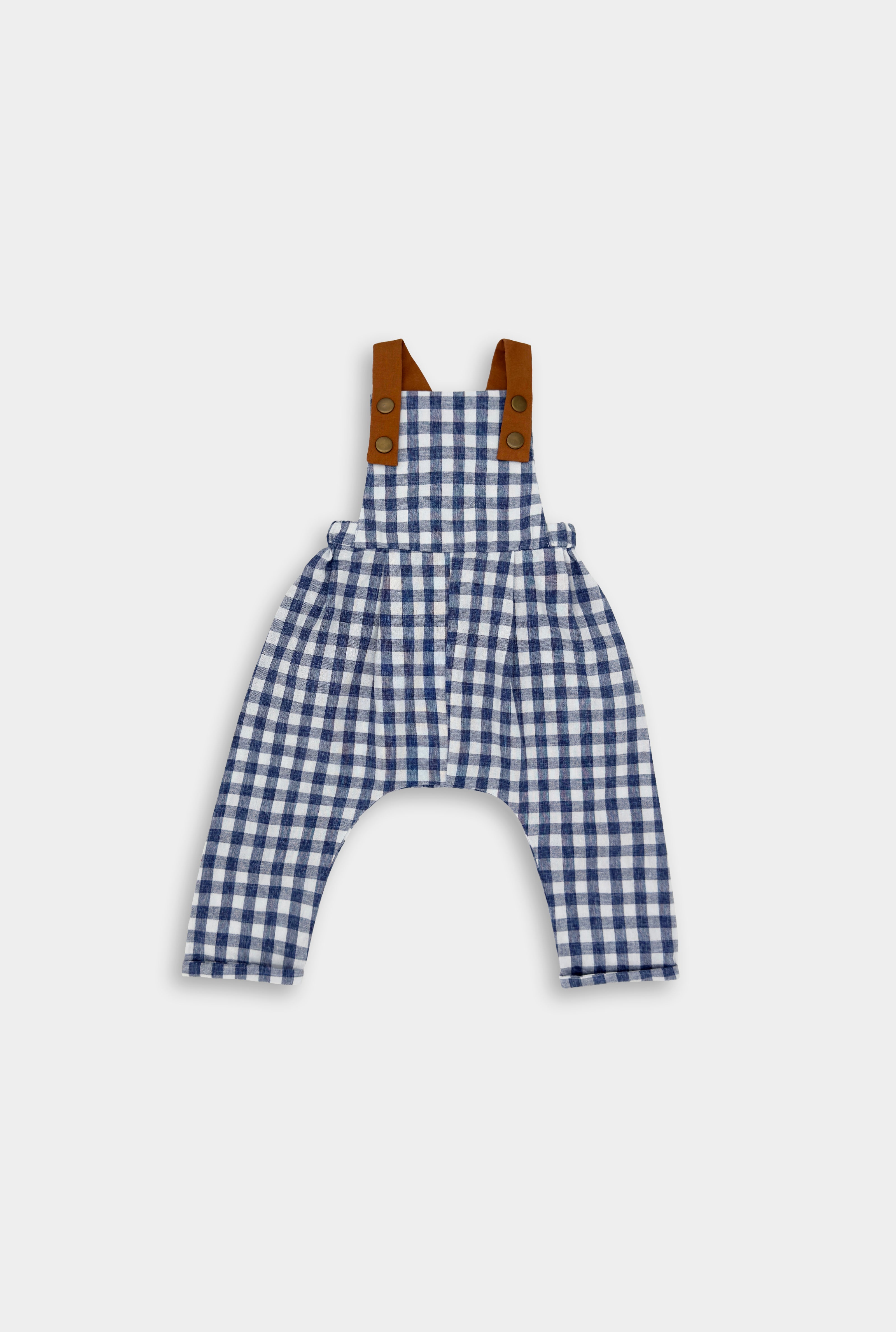 Blue Gingham Linen Long Overalls for kids, featuring gender-neutral design perfect for passing down, breathable fabric for comfort, stylish pleats for elegance, durable leather-looking straps, and adjustable straps for a perfect fit. Made by a sustainable brand focused on eco-friendly practices and materials, promoting responsible fashion for children.