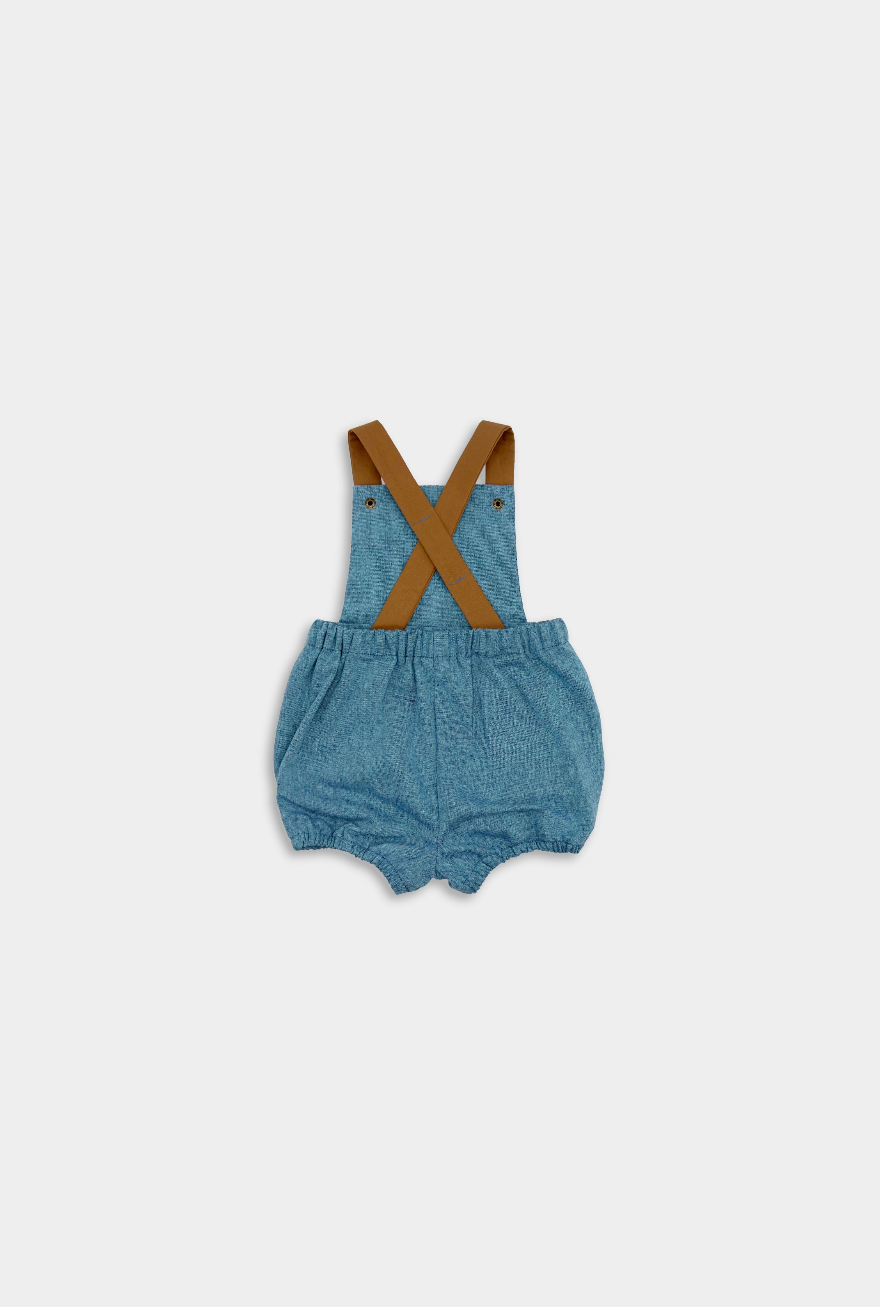 Back view of the Blue Jay bubble romper. This gender-neutral romper is ideal for playtime and includes brown adjustable straps for a customizable fit, elasticized legs for easy movement during summer activities, and a timeless style that is perfect for any occasion, boys and girls.