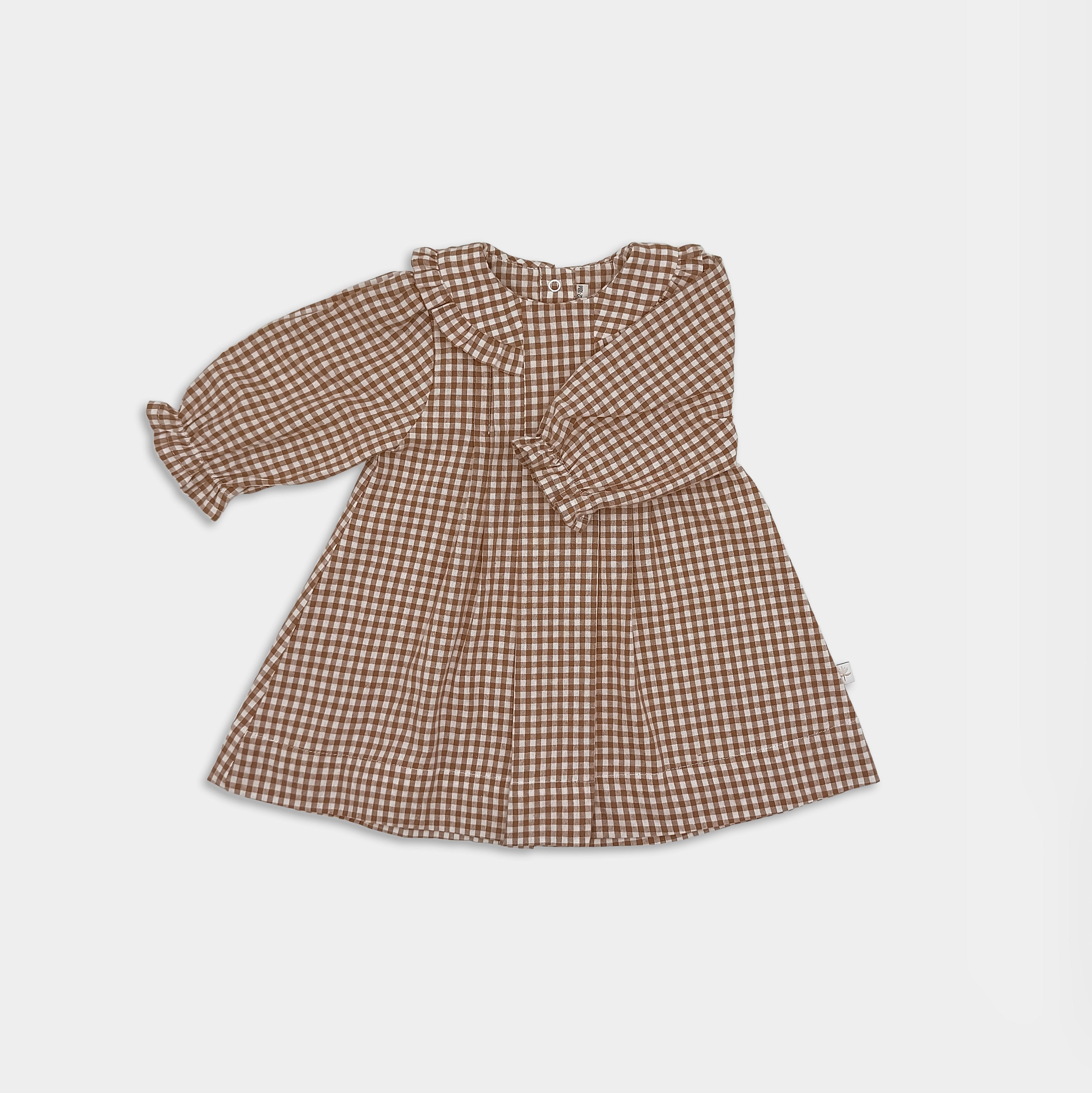 Front view of brown gingham dress with 3/4 long sleeves on a light grey  background