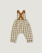 A baby romper with brown suspenders featuring a beige and white gingham check pattern, laid flat on a light gray background.