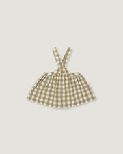 A small sleeveless dress with shoulder straps in a beige and white gingham check pattern, shown flat against a light gray background.