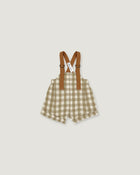 A baby romper with brown suspenders, featuring a beige and white gingham check pattern, shown flat on a light gray background.