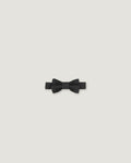 Black bow tie made of linen on a white background