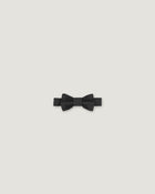 Black bow tie made of linen on a white background