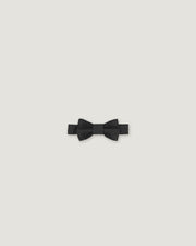 Black bow tie made of linen on a white background