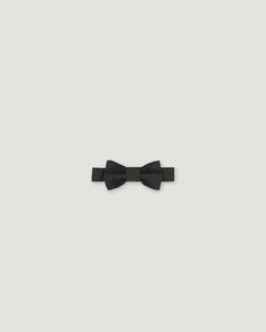 Black bow tie made of linen on a white background