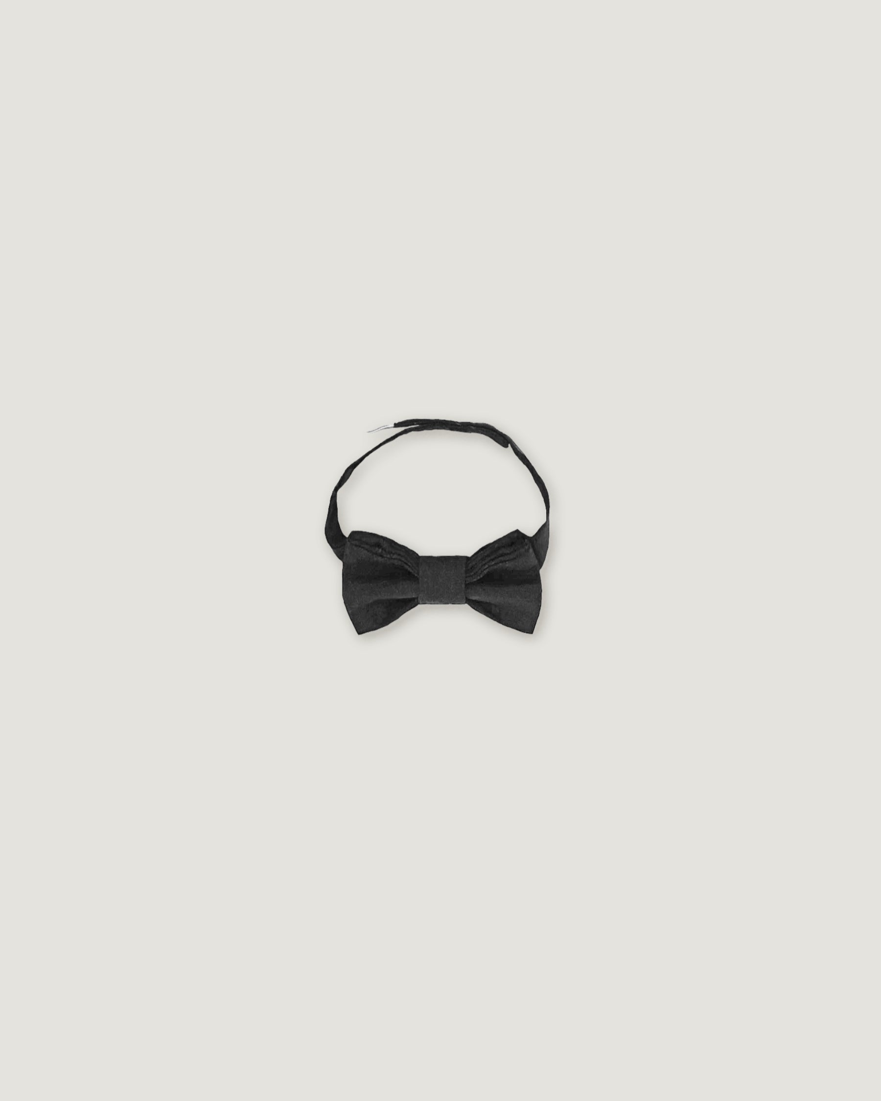 Black linen bow tie for children on a white background