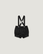 Black baby boy's suspenders shorts with adjustable shoulder straps and a white brand tag, shown flat on a light gray background.