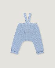 A pair of children's blue and white gingham suspenders with a high waist and wide legs, laid flat on a light beige background.