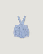 A baby romper with blue and white gingham check pattern and adjustable shoulder straps, shown flat on a light beige background.