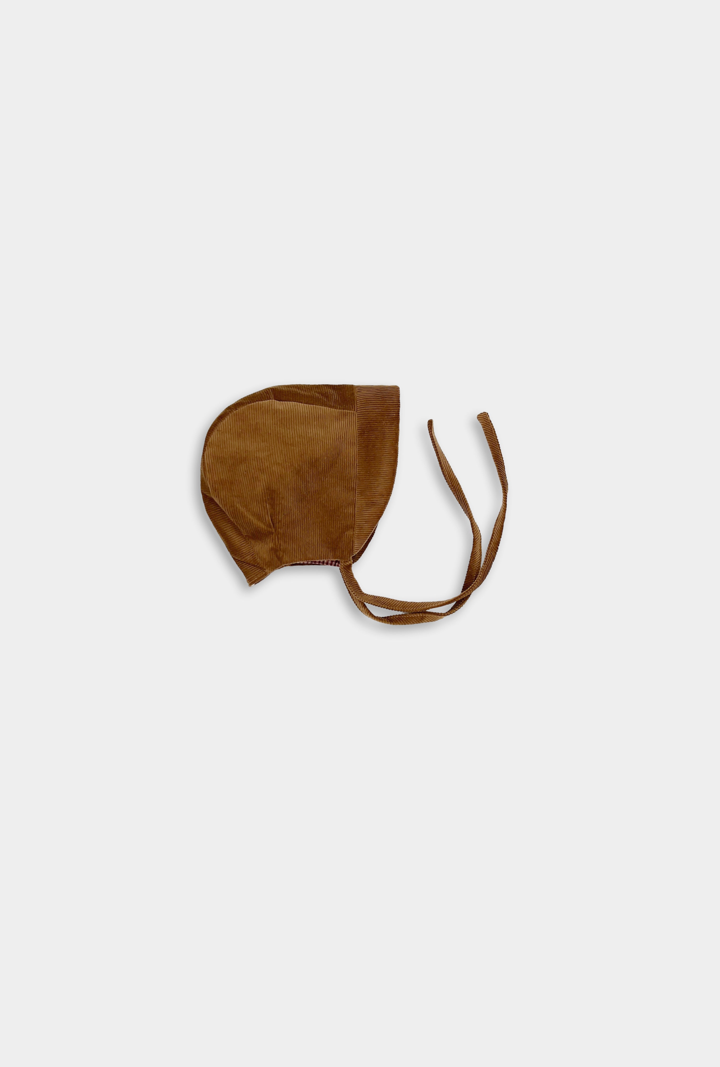 Photo of the Camel Bonnet alone - This image showcases the cozy corduroy bonnet, highlighting its classic design and soft texture, making it an adorable accessory for little ones