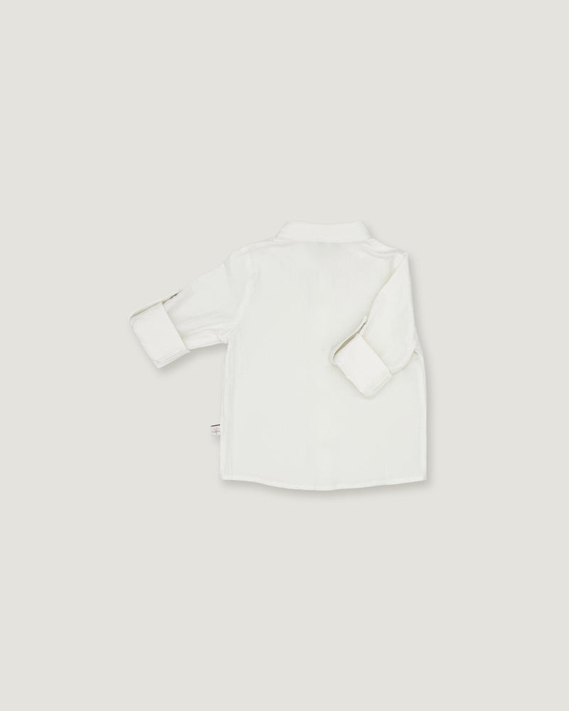 A white long-sleeve button-up shirt shown from the back, laid flat on a light gray background.