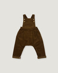 A pair of dark brown corduroy baby overalls with adjustable shoulder straps and four decorative buttons, laid flat against a light gray background.