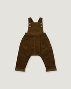 A pair of dark brown corduroy baby overalls with adjustable shoulder straps and four decorative buttons, laid flat against a light gray background.
