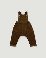 A pair of dark brown corduroy baby overalls with adjustable shoulder straps and four decorative buttons, laid flat against a light gray background.