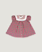 A toddler girl's dress featuring a red and white gingham pattern, a white ruffled collar with a striped inner lining, and puffed sleeves, shown flat on a light gray background.