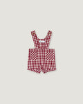 A baby romper in a red and white gingham check pattern, featuring adjustable shoulder straps and front patch pockets, displayed flat against a light gray background.