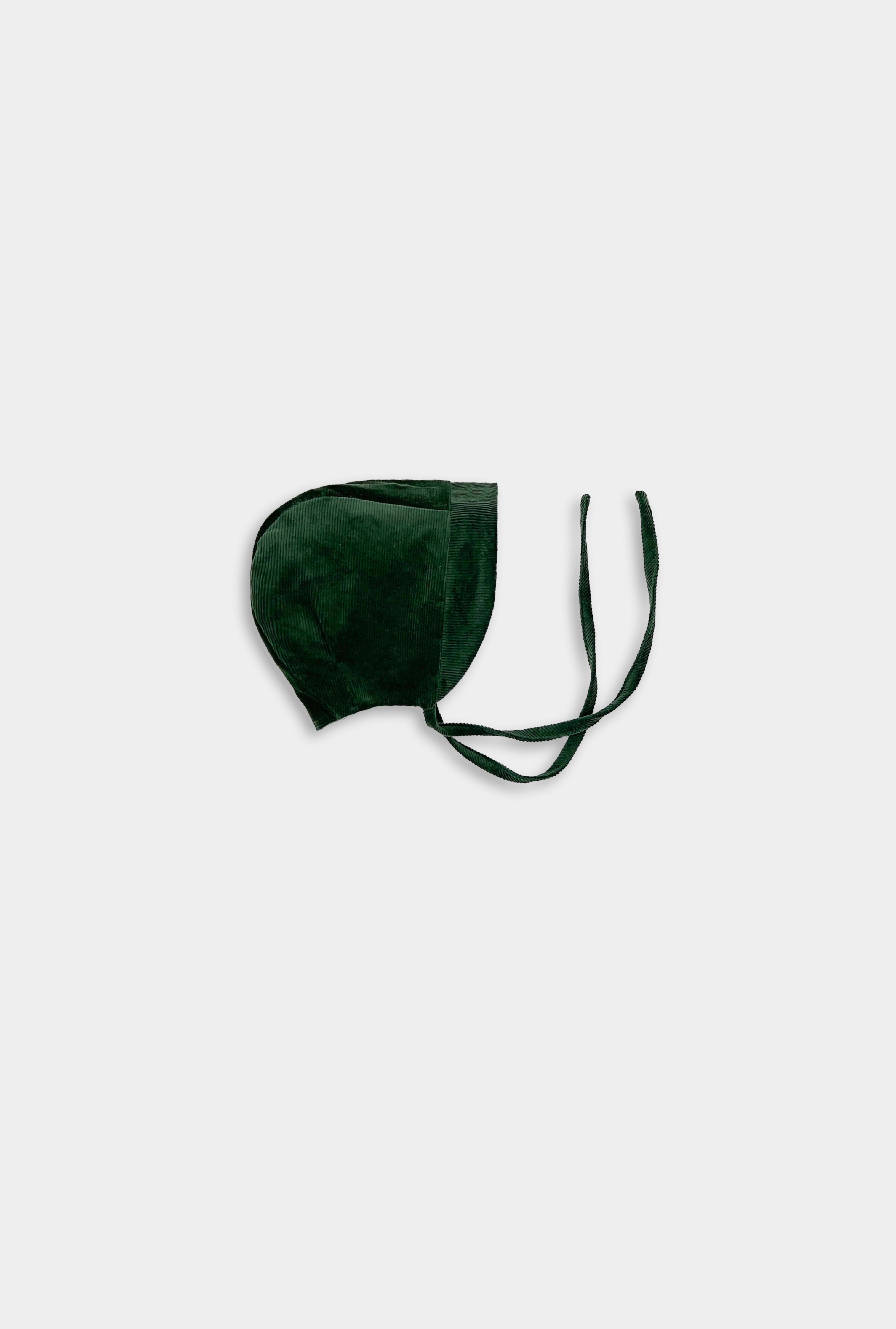Cozy corduroy bonnet in Evergreen, showcasing its classic design and soft, sustainable fabric, perfect for little ones.