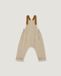 A pair of beige harem-style baby overalls with brown suspenders, shown flat against a light gray background.