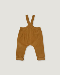 A pair of toddler corduroy overall pants in a warm camel brown color, featuring adjustable shoulder straps and rolled cuffs, shown flat on a light gray background.