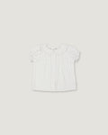 A white short-sleeve baby top with a ruffled Peter Pan collar and subtle vertical pleats, shown flat against a light gray background.