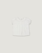 A white short-sleeve baby top with a ruffled Peter Pan collar and subtle vertical pleats, shown flat against a light gray background.