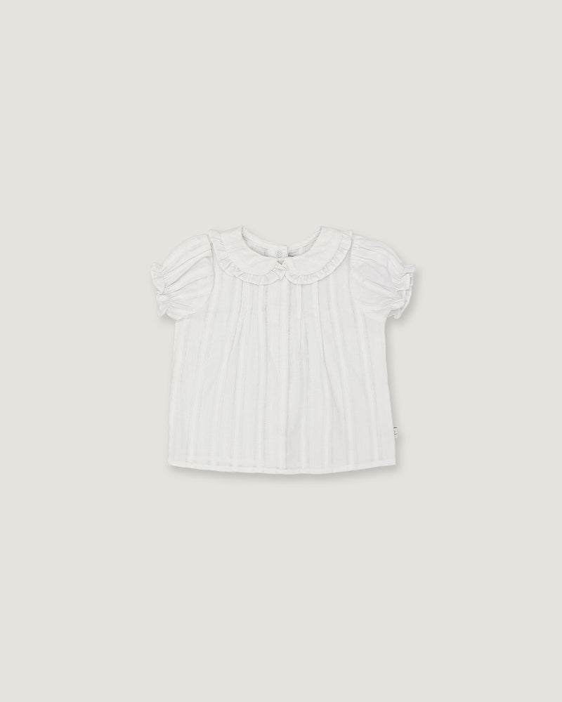A white short-sleeve baby top with a ruffled Peter Pan collar and subtle vertical pleats, shown flat against a light gray background.