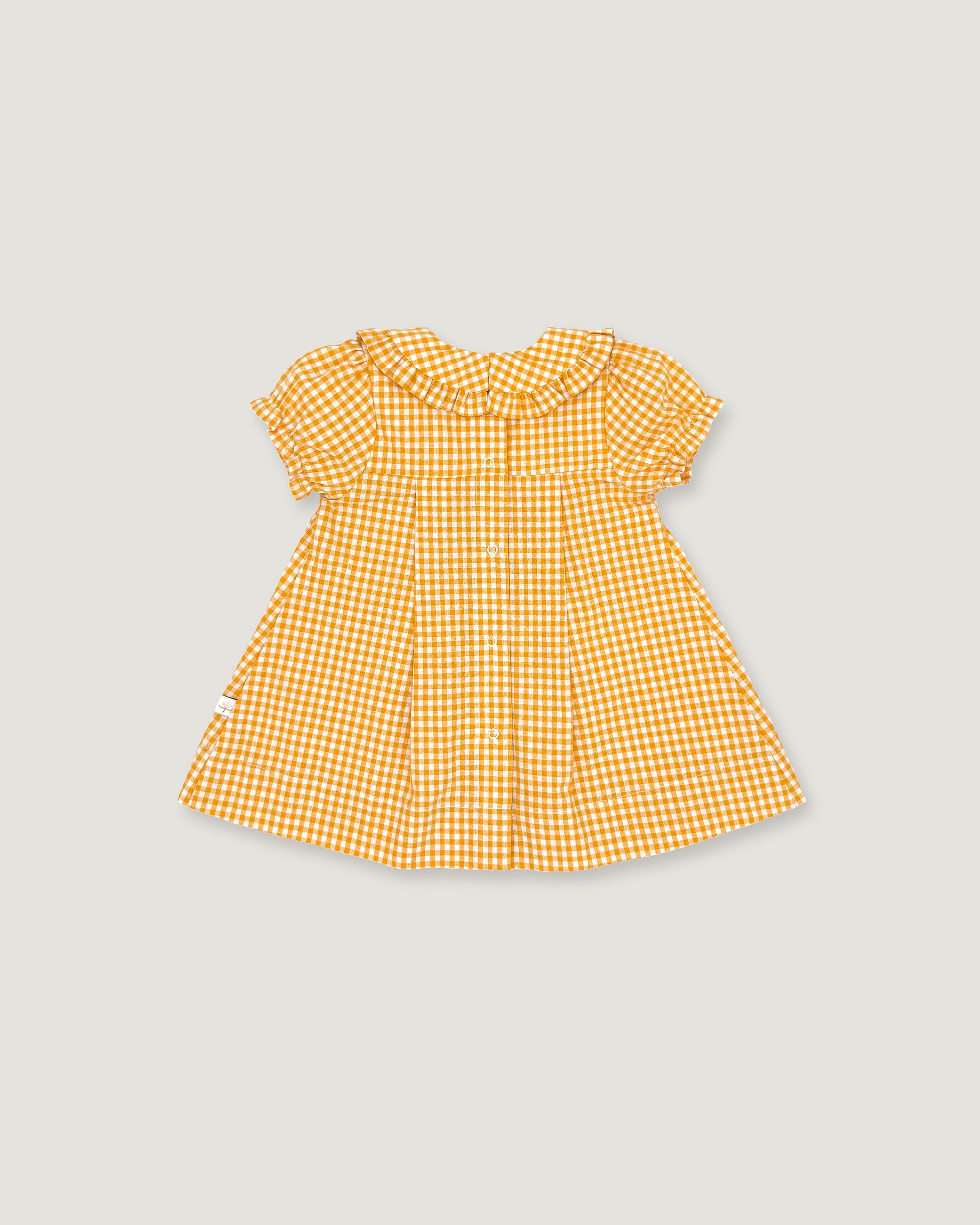 The back of a yellow and white gingham check baby dress with short flutter sleeves and a ruffled collar, shown flat on a light gray background.