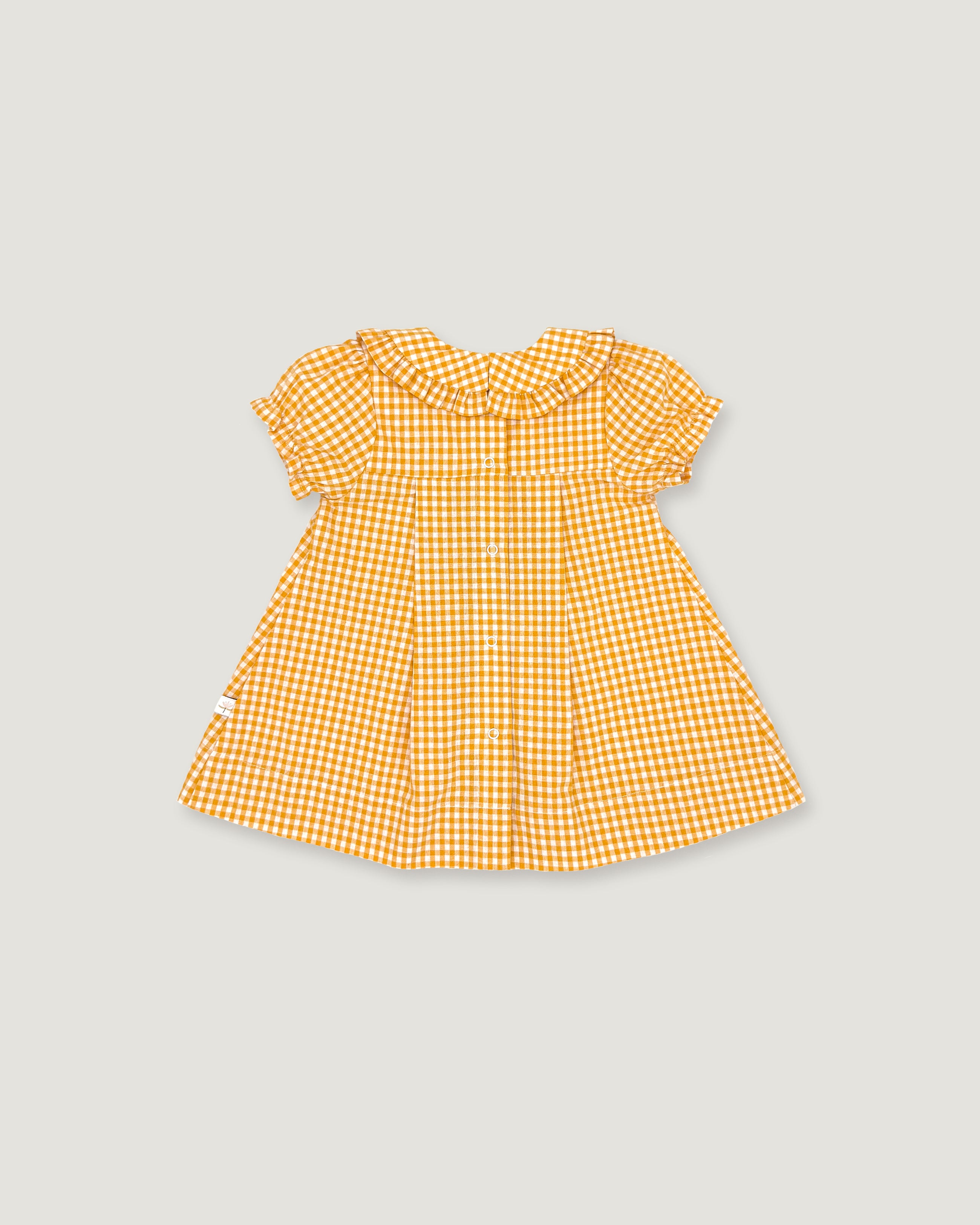 The back of a yellow and white gingham check baby dress with short flutter sleeves and a ruffled collar, shown flat on a light gray background.