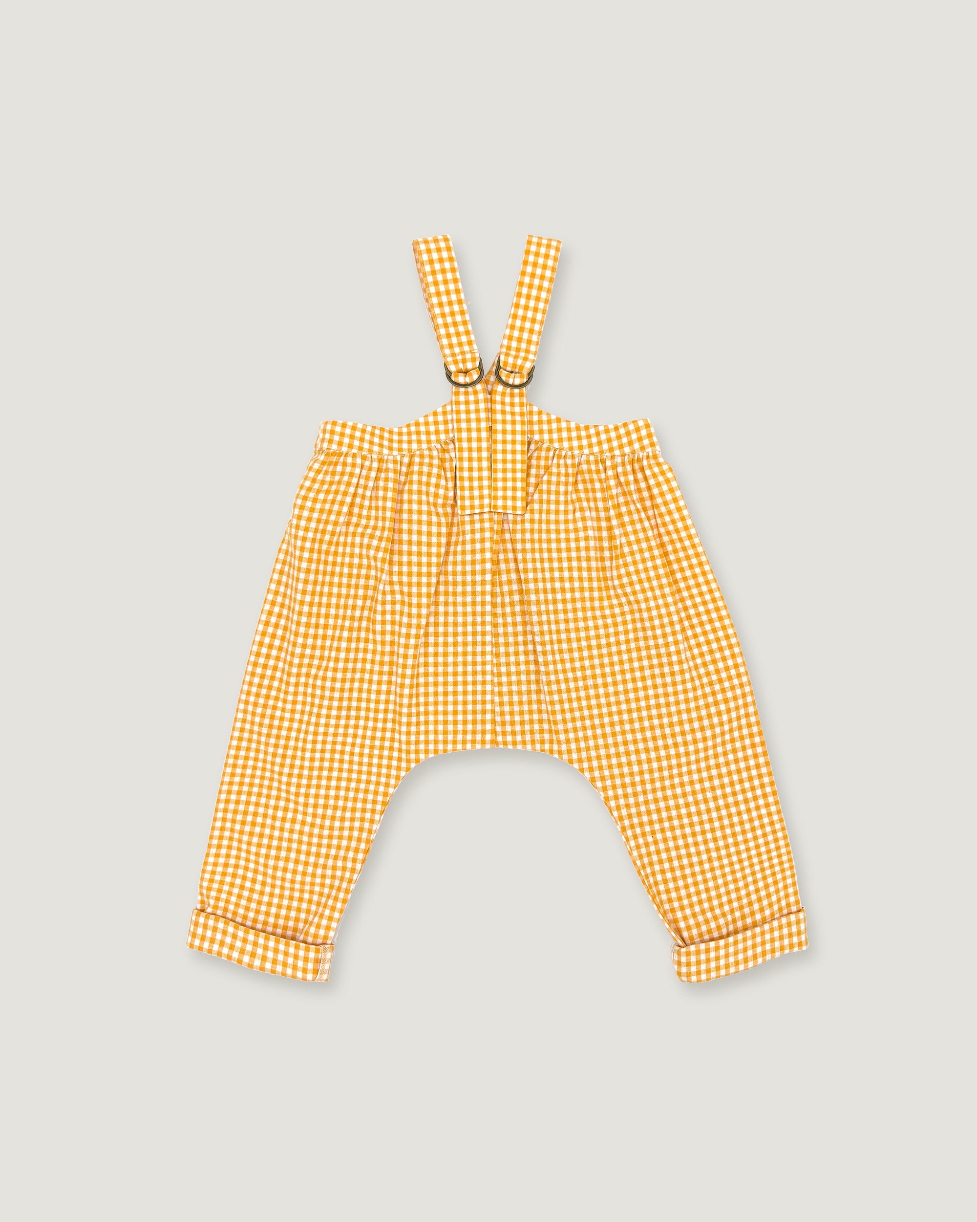 Yellow and white gingham baby pants with adjustable suspenders, displayed flat against a light gray background.