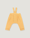 A pair of yellow and white gingham baby pants with shoulder straps, laid flat on a light gray background.