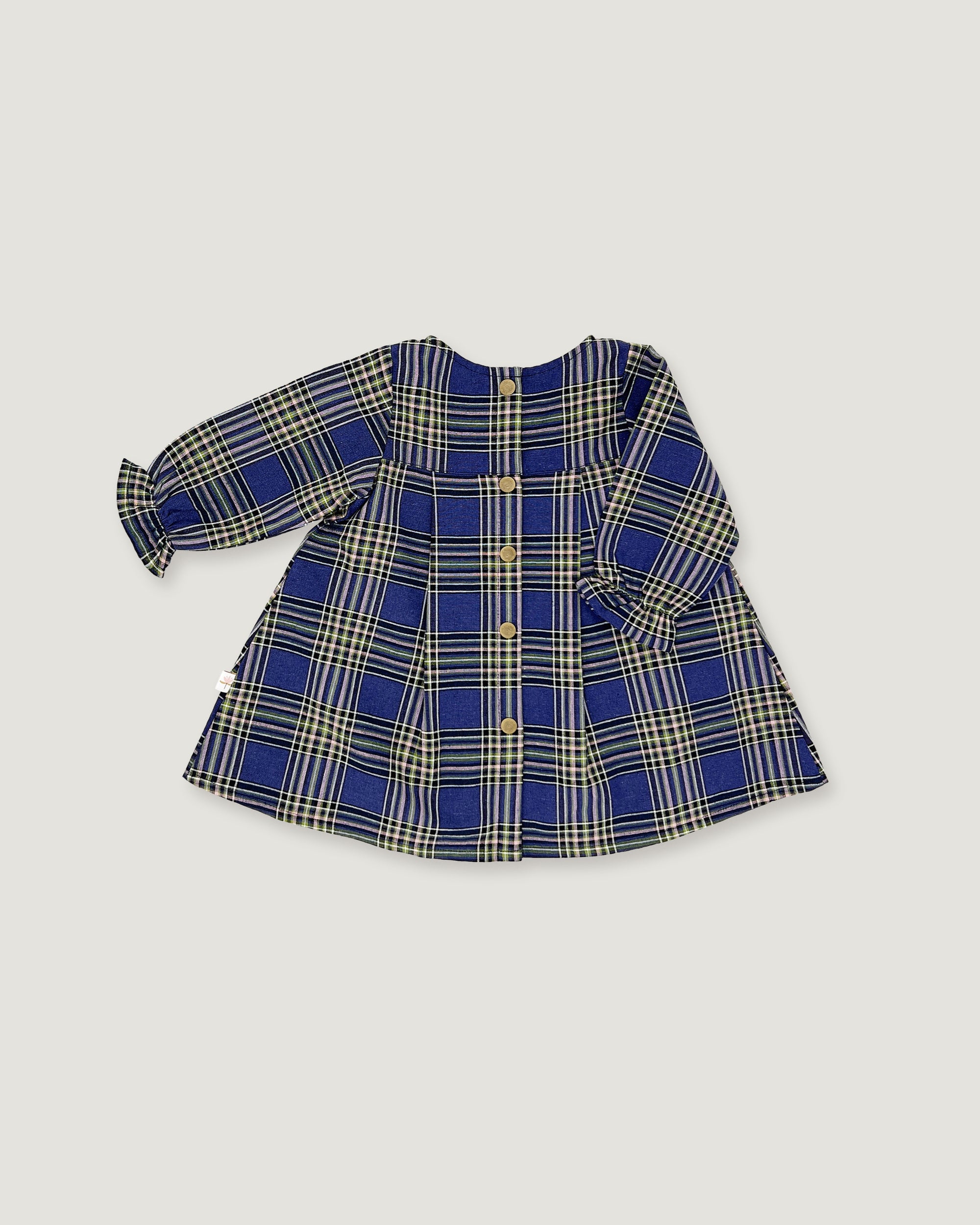 A long-sleeve plaid button-front top for toddlers, featuring a royal blue, beige, and white tartan pattern with gold buttons, laid flat on a light gray background.